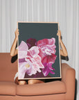 Woman holding a large pink flower fine art print named ’Balanced’.